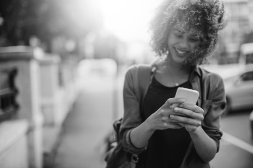 Woman holding smartphone.